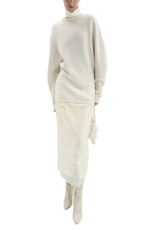 Load image into Gallery viewer, Asymmetric lace-hem midi skirt in cream